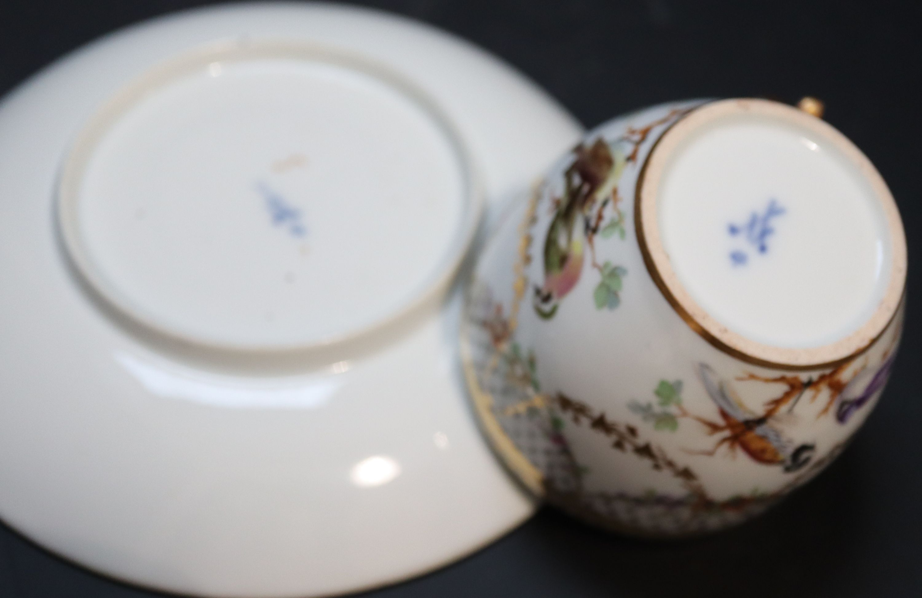 Five Continental porcelain cups and saucers, 19th century,